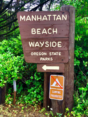 Entrance sign to Manhattan Beach State Park in Rockaway Beach Oregon.